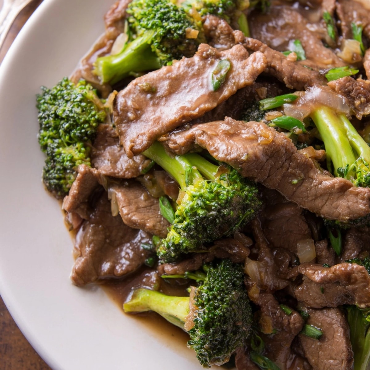 Savory Beef and Broccoli Stir-Fry: Tender beef, vibrant broccoli, glossy dark sauce.