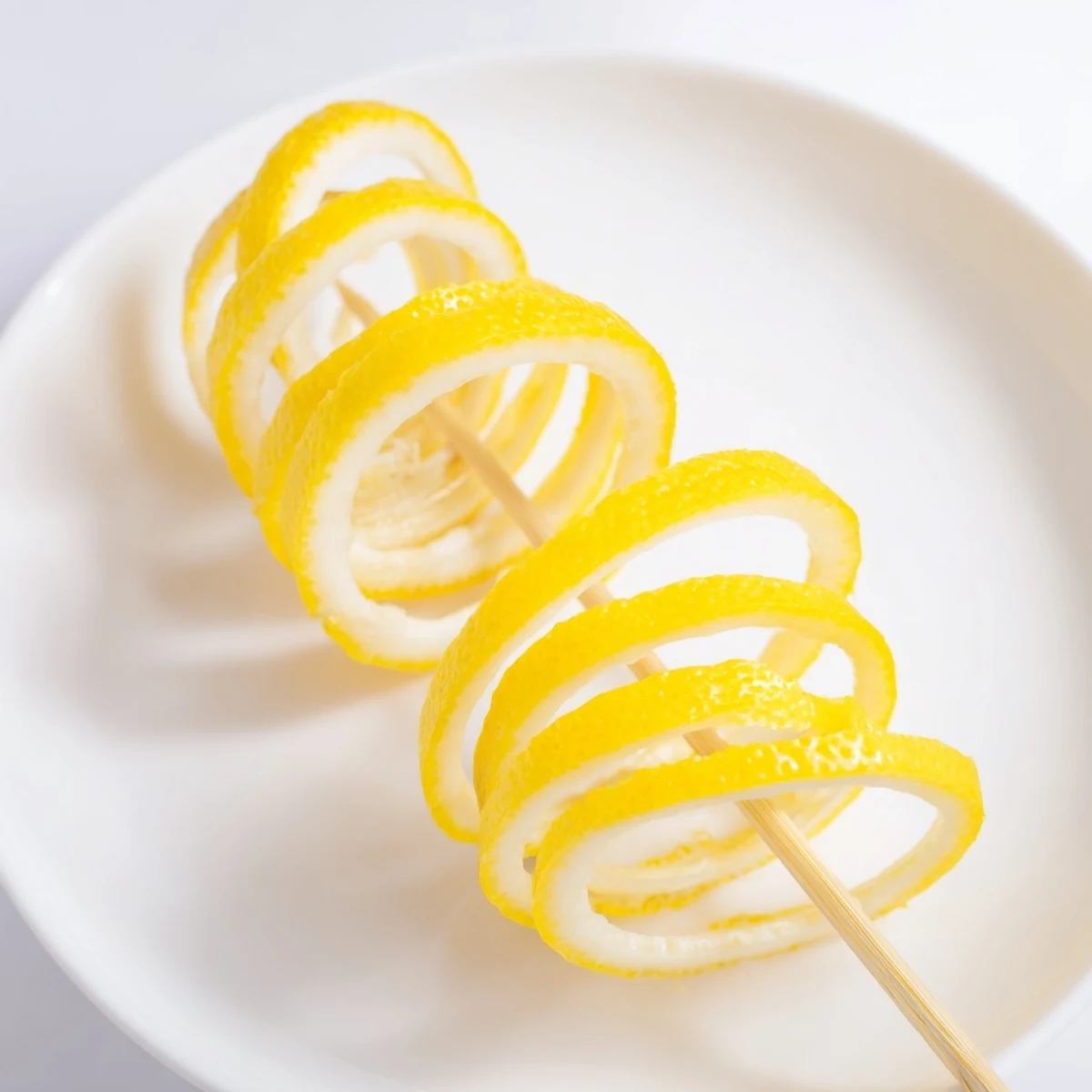 Thin lemon slices and twists: a delightful arrangement to elegantly top off desserts.