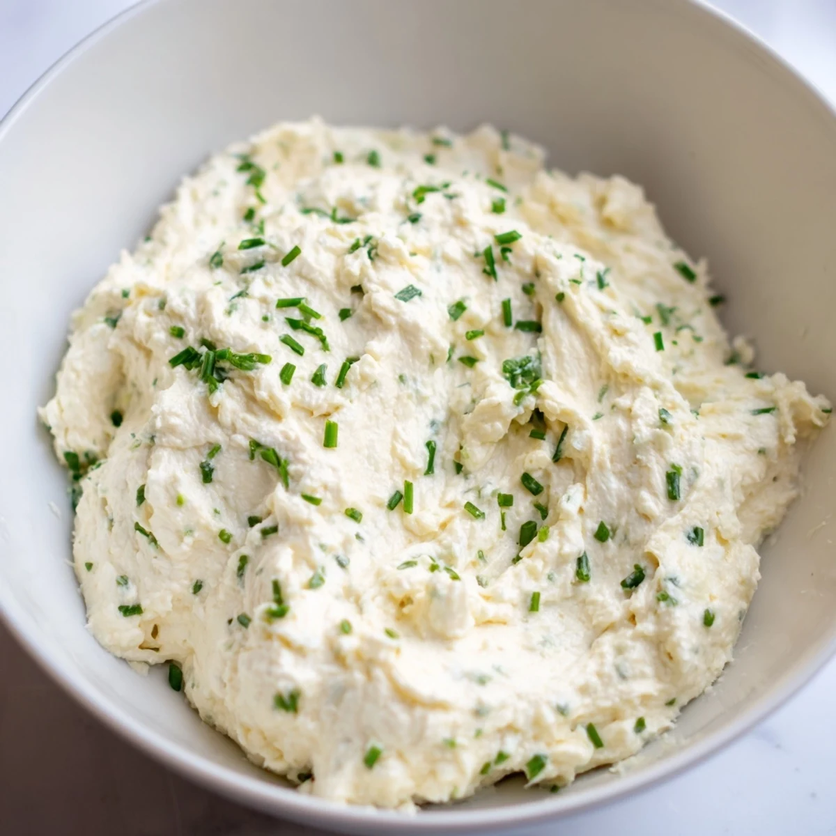 This creamy Cheese spread is ready to serve, a flavorful blend with fresh chives and lemon.