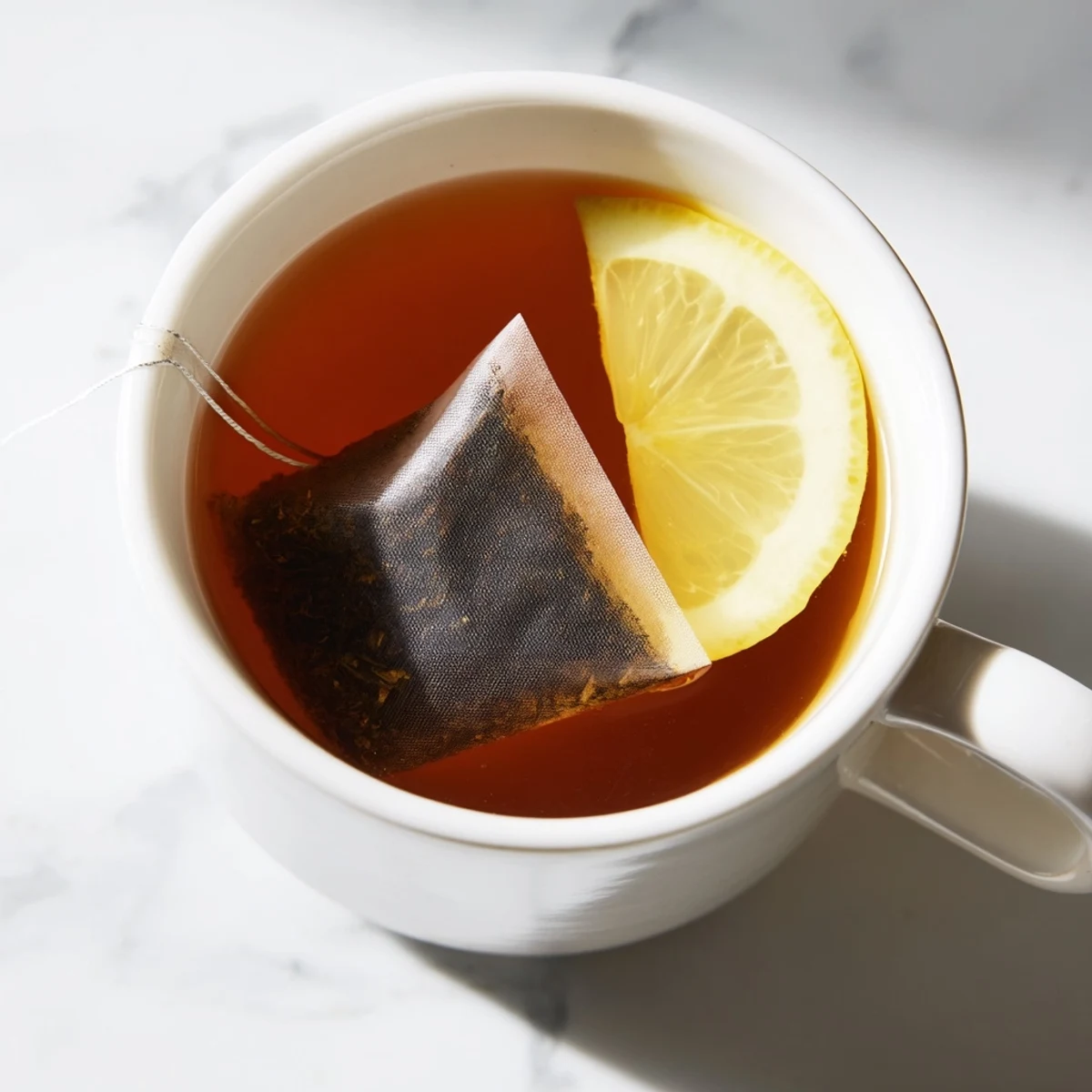 Fragrant Bag Tea, showing a tea bag steeping in hot water, for a warm and cozy moment.