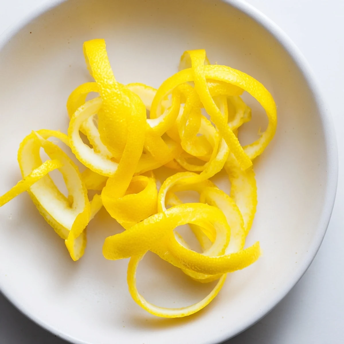 Freshly sliced lemon garnish ready to brighten drinks and dishes with incredible citrus zest.