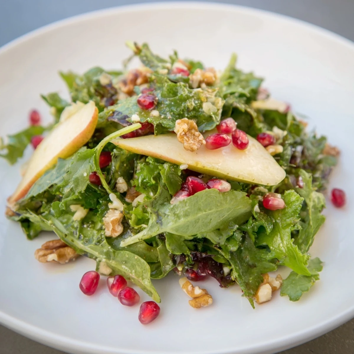 Winter Green Salad with Walnuts, showing fresh greens, pears, and toasted walnuts, ready to eat.