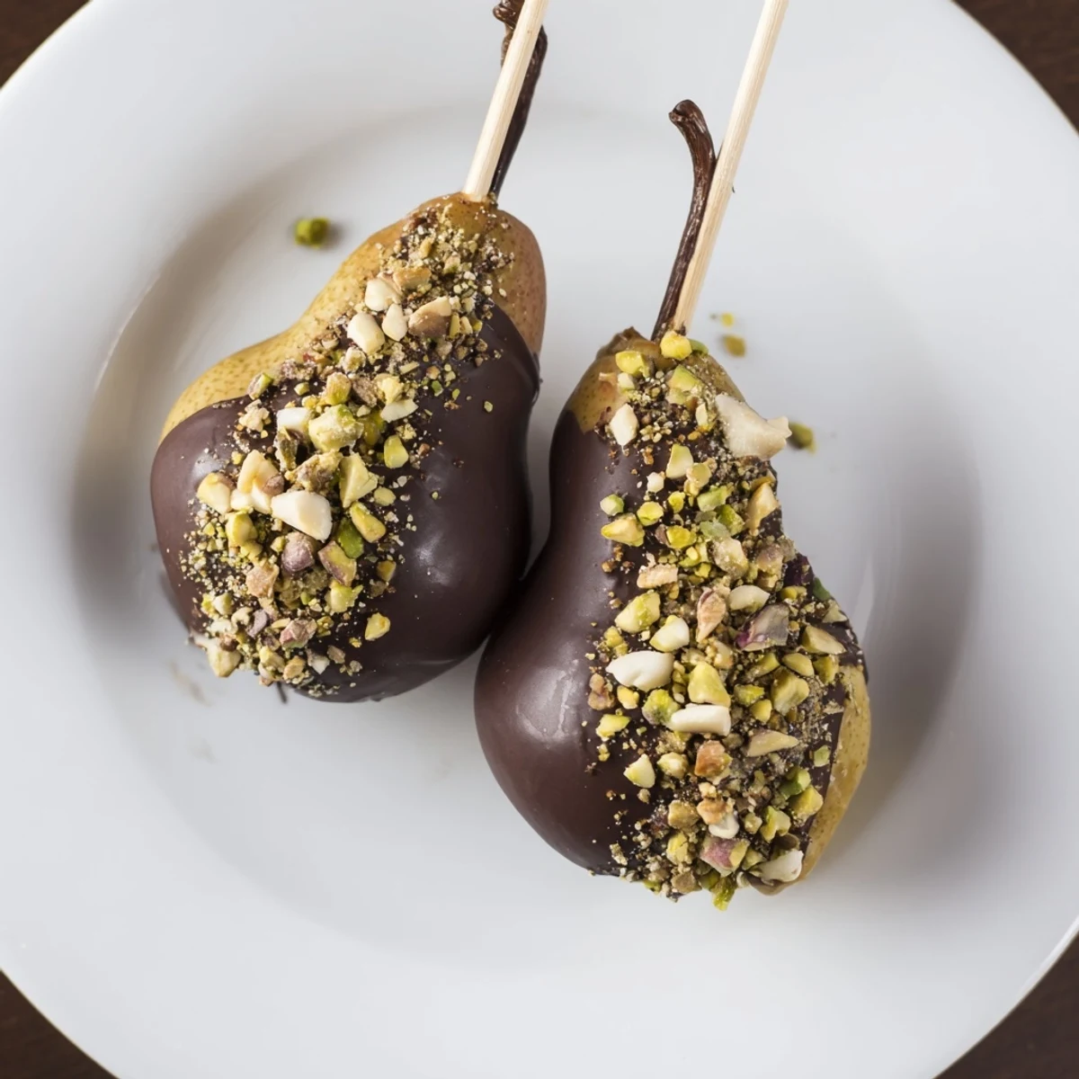 Decadent chocolate covered pears with nuts, ready to serve after a quick 20-minute prep time.