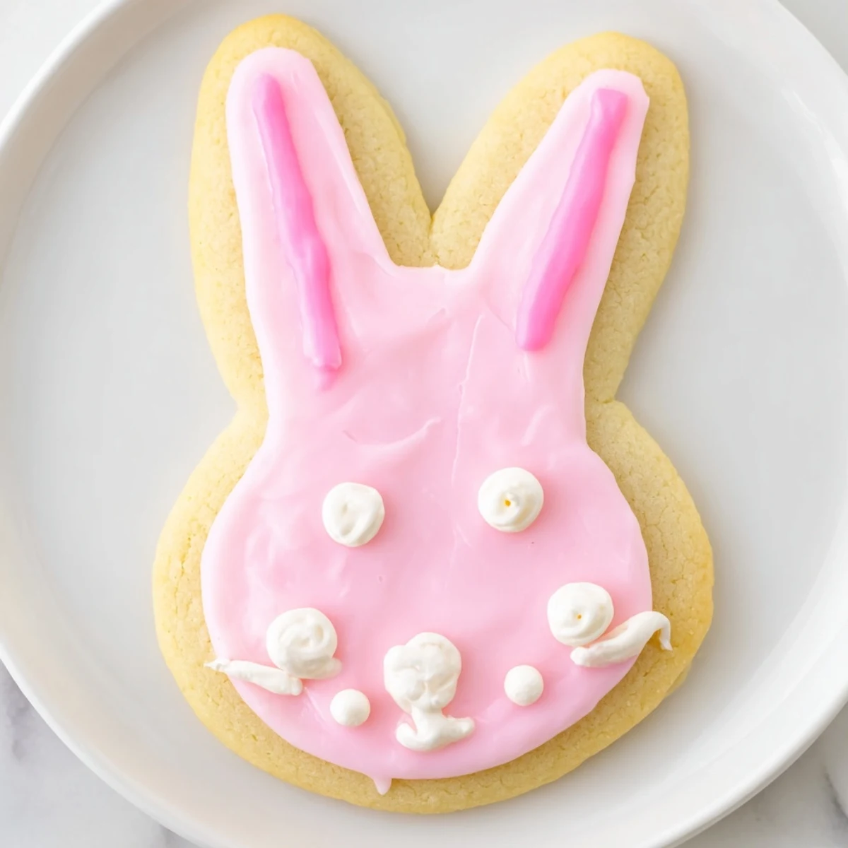 Soft, golden-brown Easter Bunny Sugar Cookies decorated with colorful royal icing for springtime snacking.