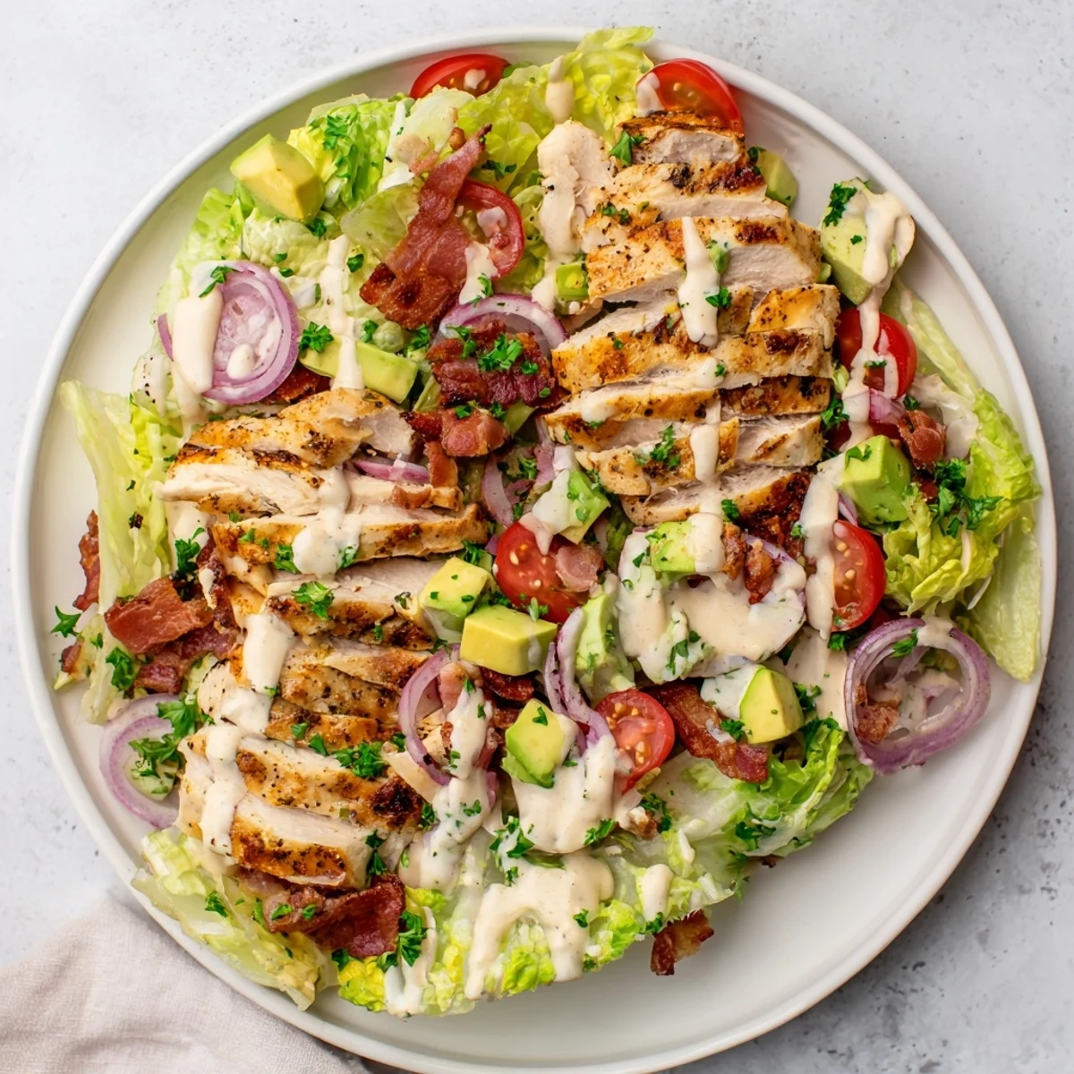 Fresh BLT Chicken Salad with juicy sliced chicken, crispy bacon crumbles, and ripe cherry tomatoes tossed in creamy dressing.