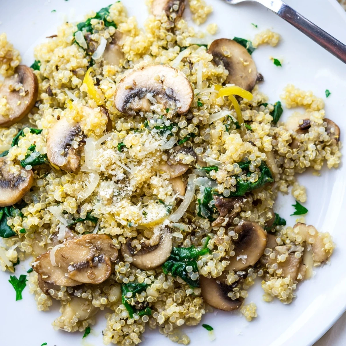 Golden sautéed mushrooms and garlic blend with fluffy quinoa in this Garlicky Mushroom Quinoa dish, served warm.
