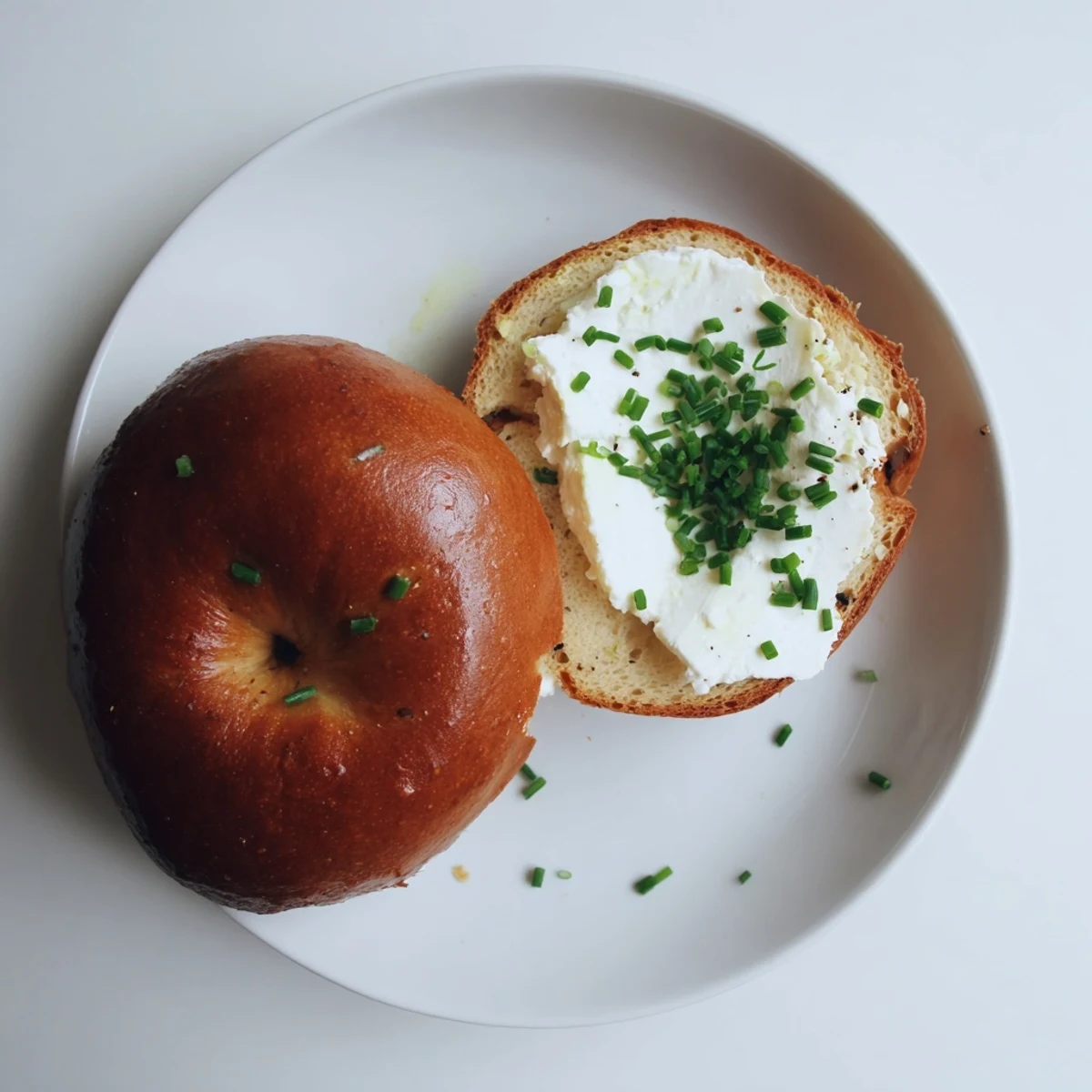 These high-protein bagels feature a chewy texture and a generous spoonful of cottage cheese, perfect for a healthy breakfast.