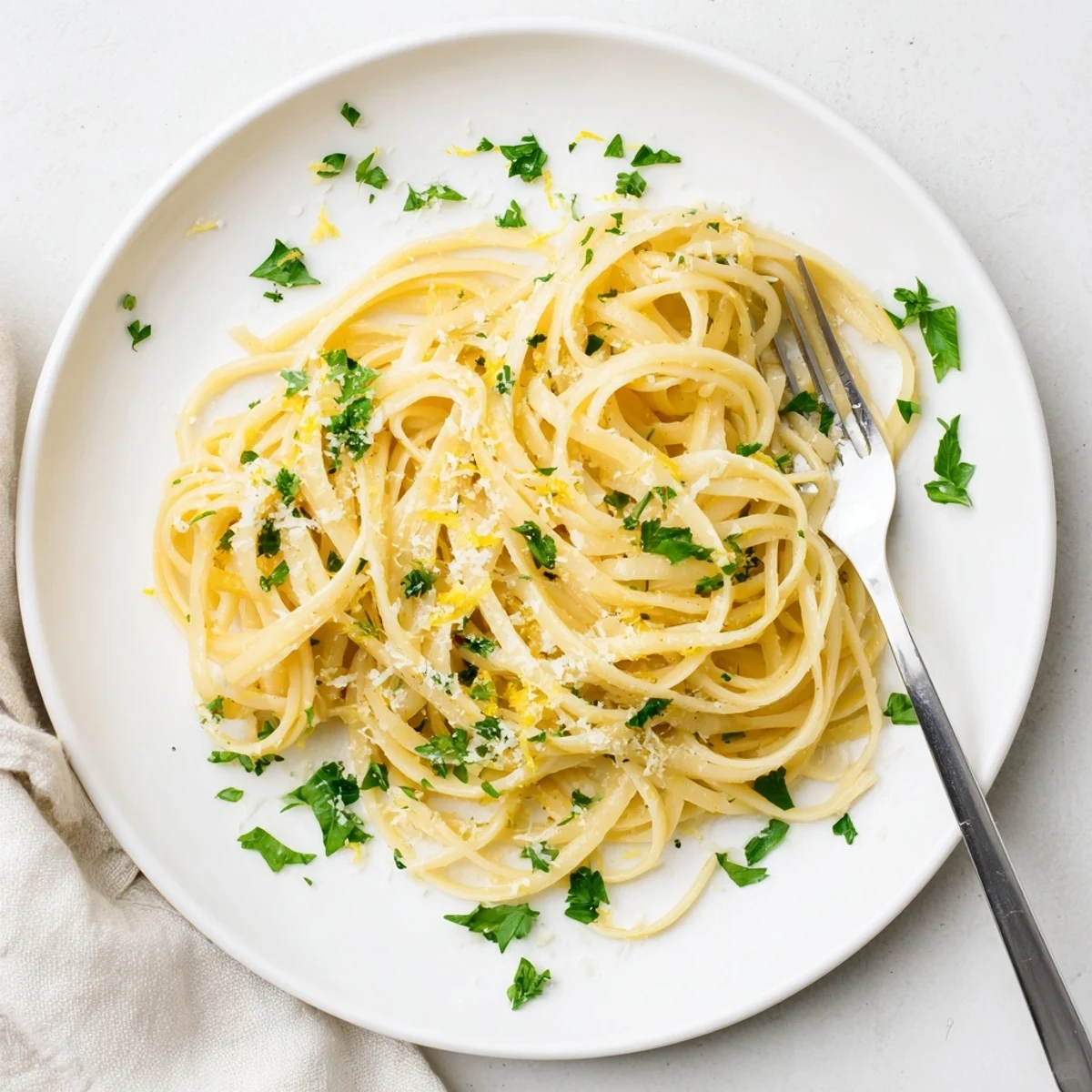 Creamy one pot garlic butter pasta tossed in silky parmesan sauce with fresh parsley garnish