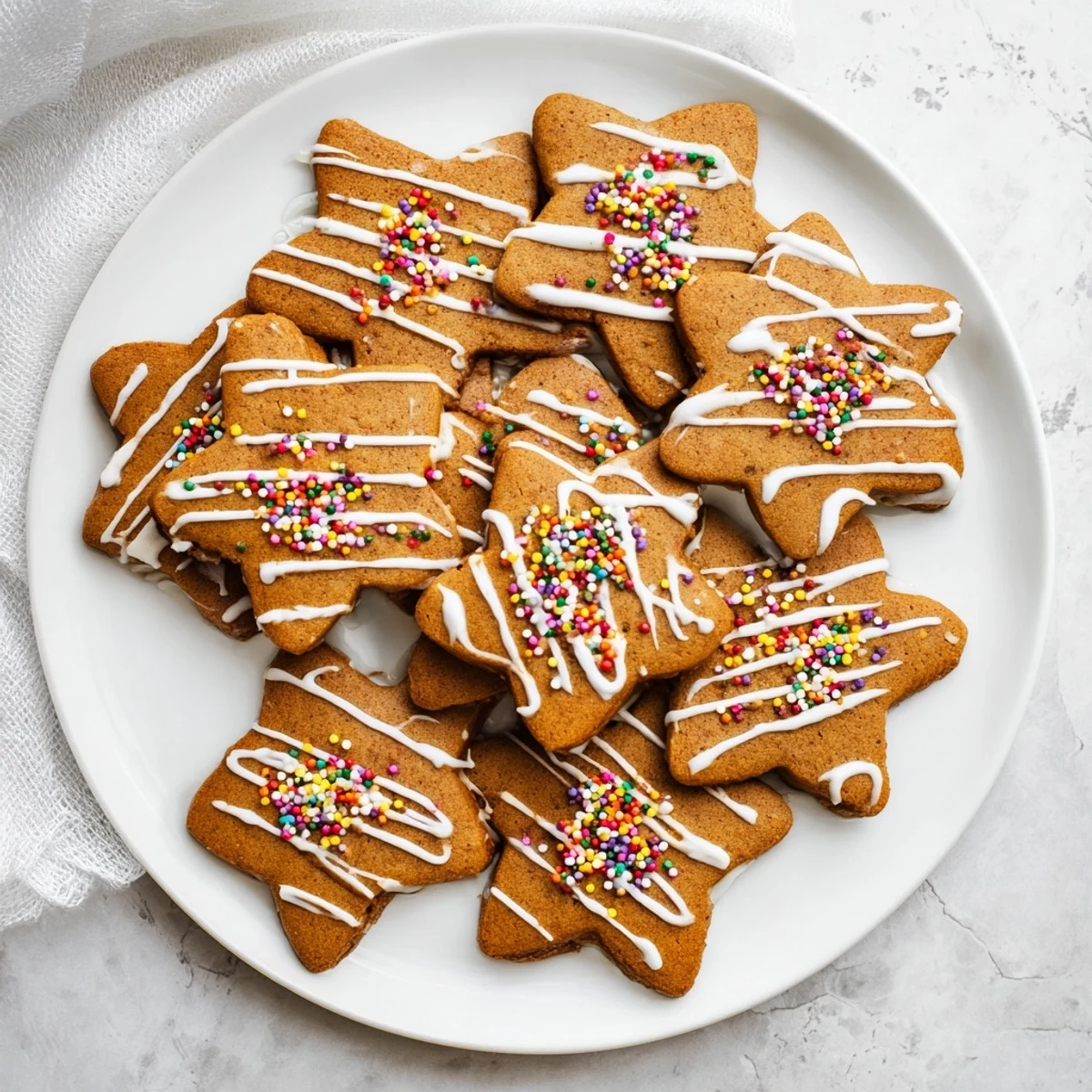 Soft spiced classic cut out gingerbread cookies arranged on a wooden cutting board ready for holiday decorating