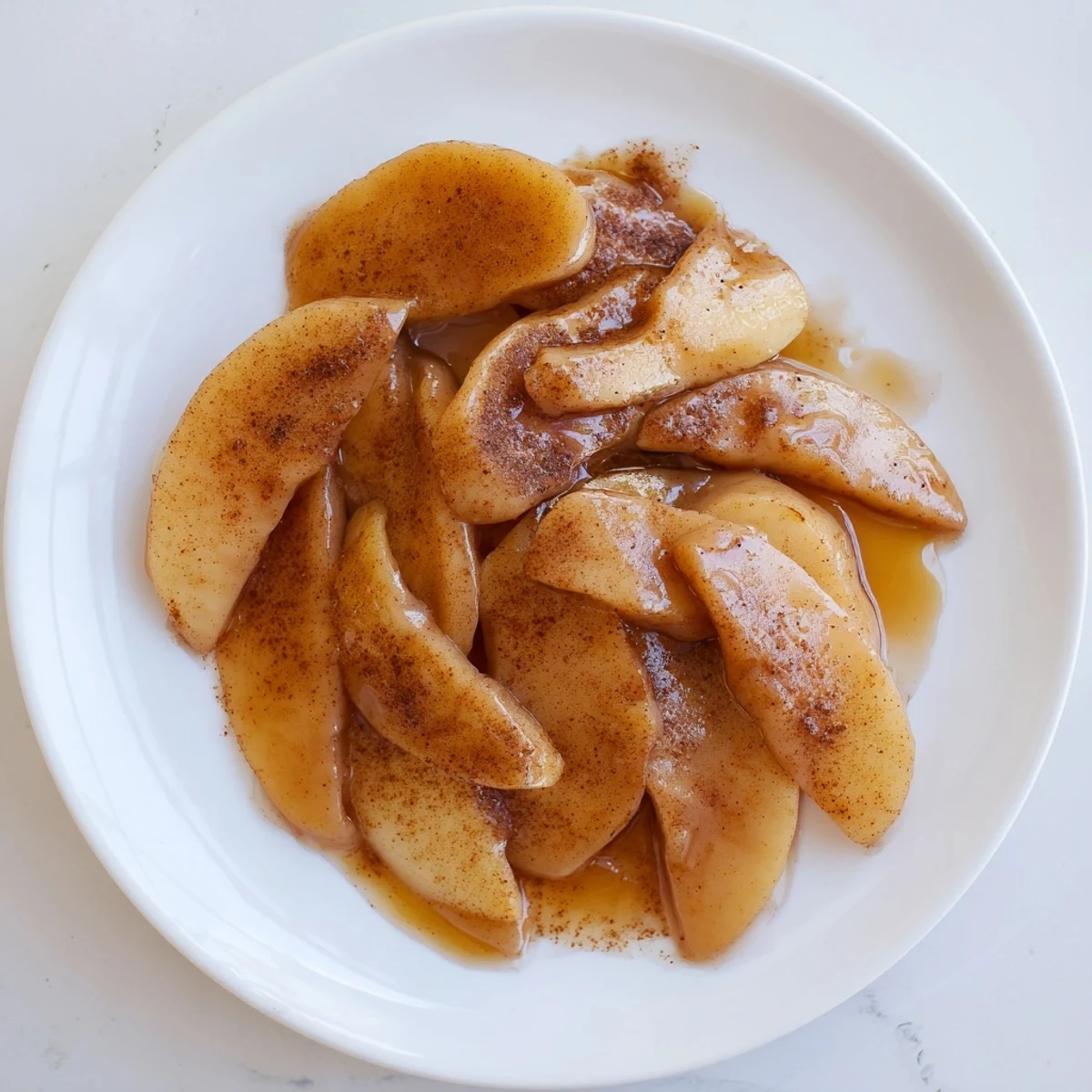 Golden tender apple slices swim in rich cinnamon syrup from the Instant Pot