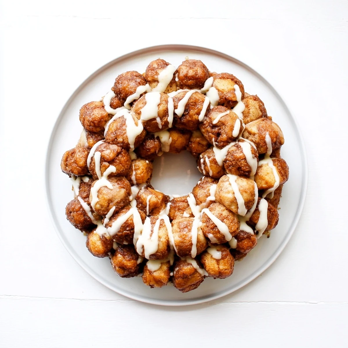 Golden high protein no sugar monkey bread with cinnamon coating in a bundt pan