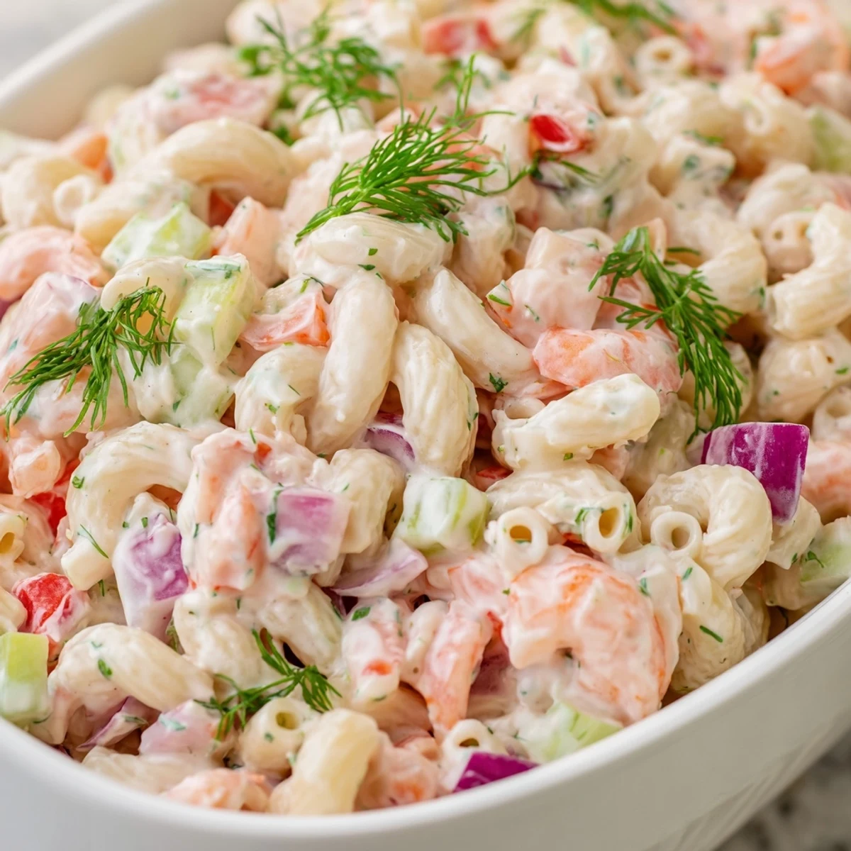Creamy shrimp macaroni salad in a bowl with tender shrimp and crisp vegetables