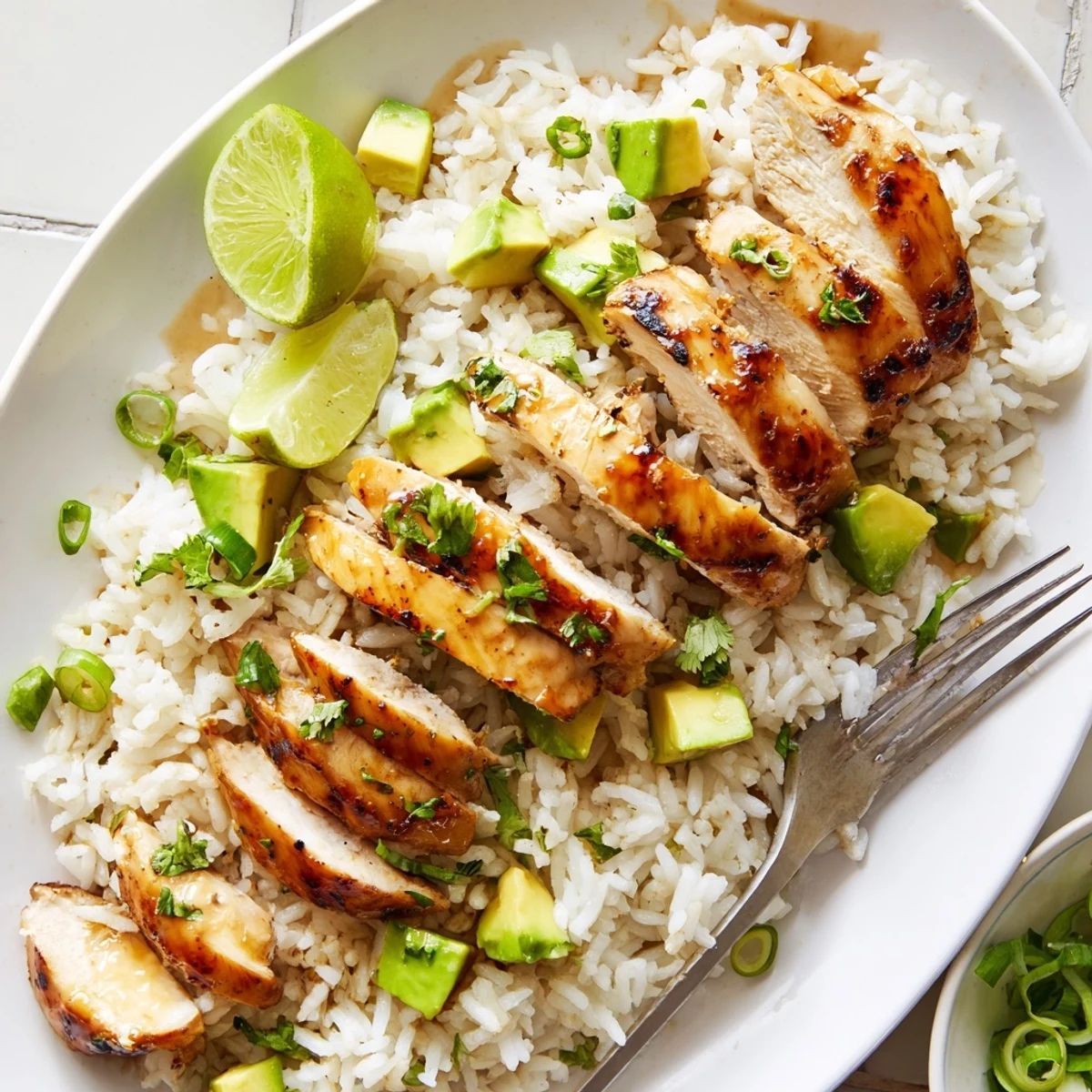 Juicy honey lime chicken with avocado rice drizzled in zesty citrus sauce