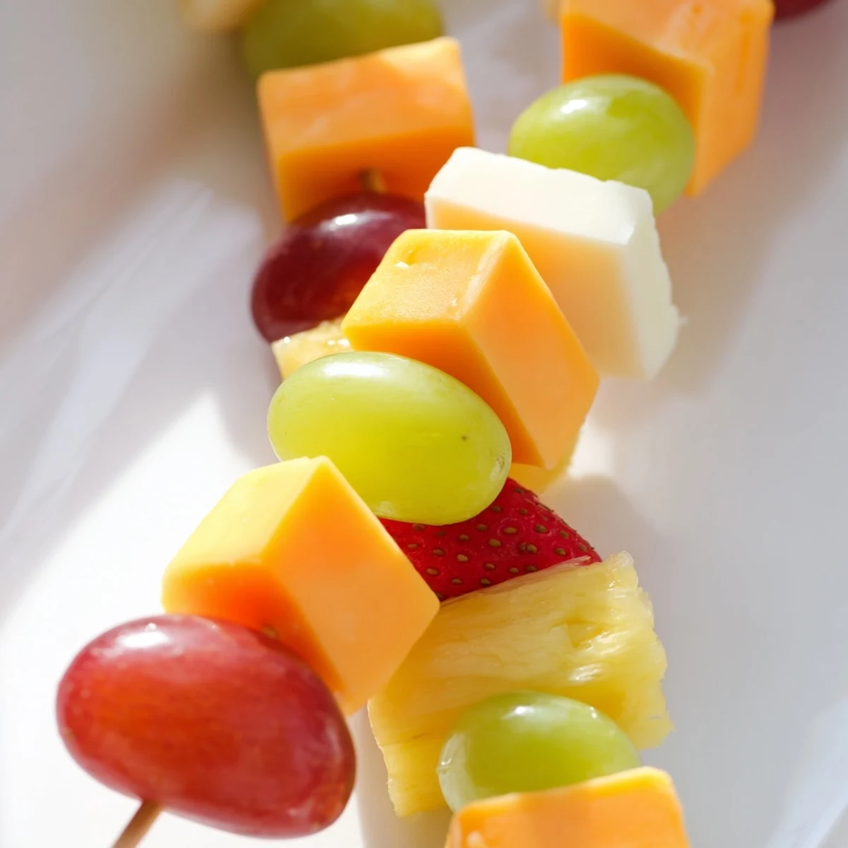 Fresh fruit and cheese kabobs featuring alternating cubes of creamy Monterey Jack and sweet ripe strawberries
