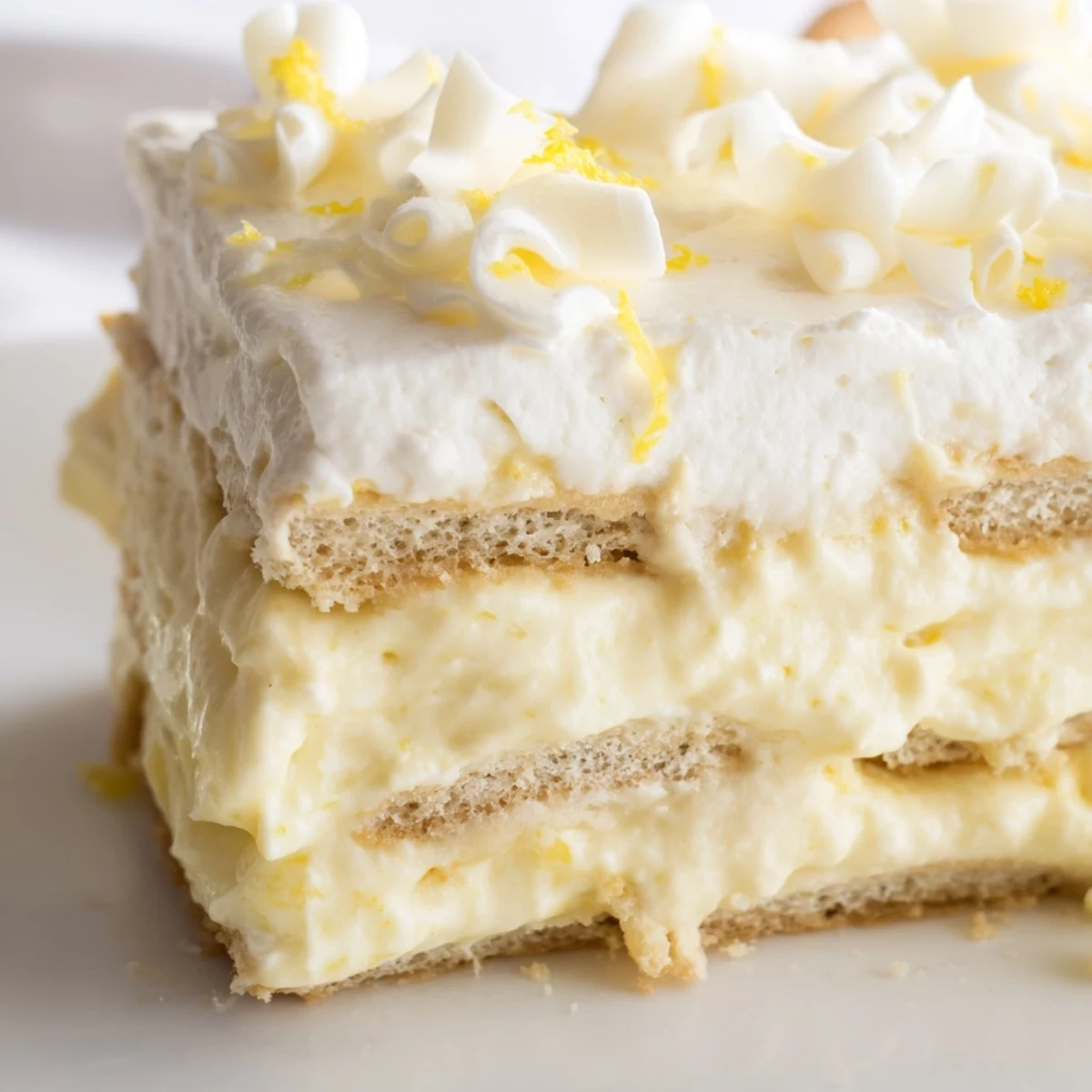 A creamy lemon tiramisu layered with syrup-soaked ladyfingers and bright citrus zest