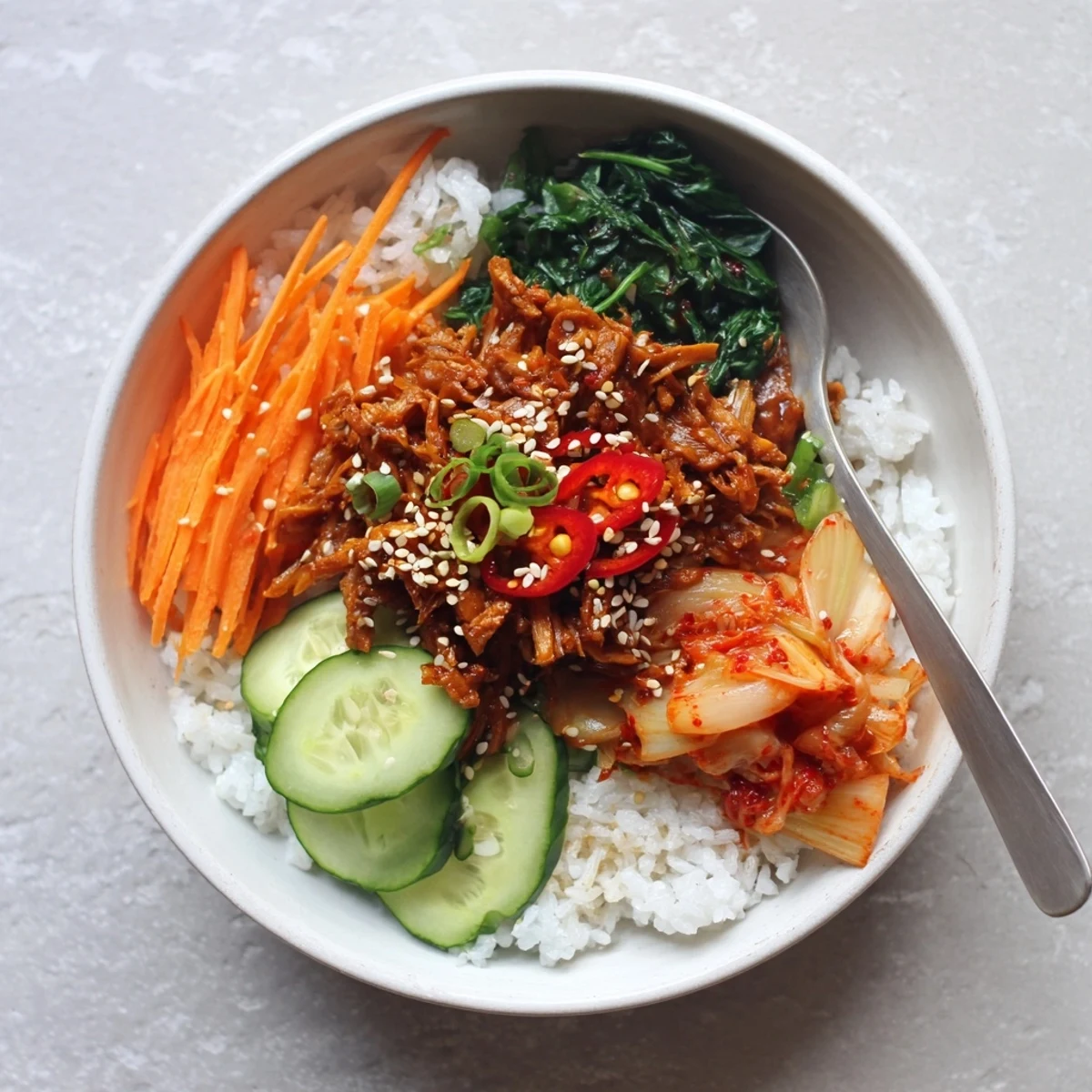 Crispy shredded tofu bulgogi bowl with sweet glazed tofu over warm white rice