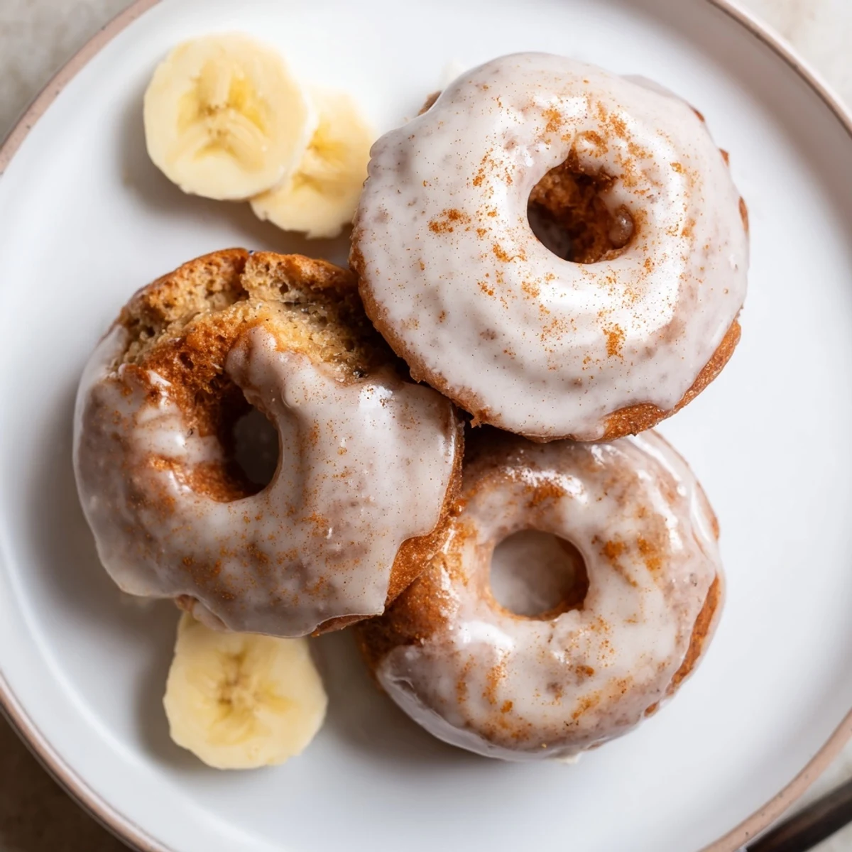 Fresh Banana Donuts cooling on wire rack, ready to glaze and eat.