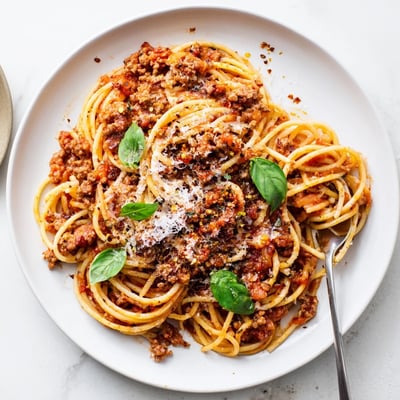 The Bear Spaghetti served in a rustic ceramic bowl with a drizzle of olive oil.
